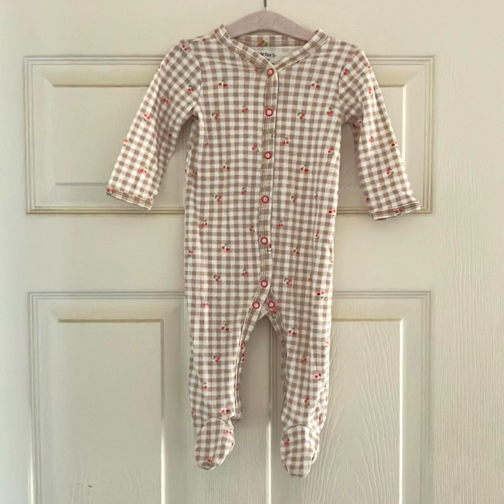 CARTERS cherry print onesie. Adorable, new and size 6 month. Perfect fit.